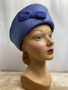 "This is a very cute stylish hat from the 1980's. It's made by Laura Ashley, 100% viscose. It's a medium periwinkle blue color. It's in very good shape. I only noticed 2 minor nubs on the top of the crown. See last photos. It looks very nice and clean. ✏️ ✏️✏️DETAILS ✏️✏️✏️ Brand: LAURA ASHLEY, made in GB Size on tag: NONE Fits like: average Color: blue Material: viscose Condition: very good (see description) Item includes: hat ✂ ✂️✂️ MEASUREMENTS ✂️✂️✂️ Head size: 22\" Height: 4\" Brim 3.75\" m Retro Blue Beach Hat, Blue Brimmed Cloche Hat For Spring, Retro Wide Brim Blue Hat, Retro Blue Bucket Hat, Retro Blue Hat For Spring, Blue Brimmed Cloche Hat For Summer, Retro Summer Boater Hat, Vintage Blue Hat With Curved Brim, Vintage Blue Short Brim Hat