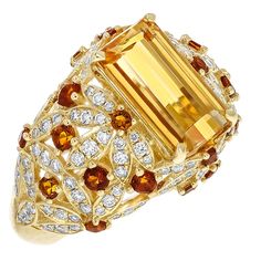 This One of a Kind Juleve Precious Topaz, Citrine, & Diamond Floral Design Ring. The Ring is Crafted in 14 Karat Yellow Gold & Features a 4.09 Carat Center Emerald Cut Precious Topaz. The Center Precious Topaz is accompanied by a Floral Design of Round Citrines that Weigh 0.65 Carats total Weight & 0.79 Carats of round Diamonds. Yellow Topaz Jewelry, Chicken Receipes, Diamond Bracelet Design, Sweet Jewelry, Round Diamond Setting, Citrine Jewelry, Imperial Topaz, Topaz Jewelry, Fantasy Closet