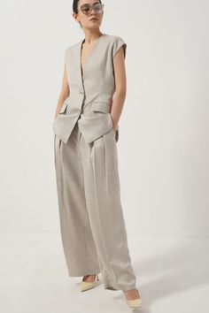 Be comfortable and stylish in these pants. These breezy bottoms feature pegged legs with generous width and a flattering fit for a timeless, modern look. Crafted from 100% cotton, these pants are sure to keep you feeling comfortable and looking chic. Chic Cotton Pantsuit For Work, Elegant Linen Pantsuit With Pockets, Modern Linen Wide Leg Pants For Workwear, Modern High-waisted Linen Wide Leg Pants, Fitted Linen Ankle-length Wide Leg Pants, Spring Wide-leg Pantsuit With Welt Pockets, Chic Cotton Pantsuit For Spring, Fitted Ankle-length Linen Wide Leg Pants, Neutral Linen Wide Leg Pants For Work