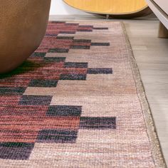 an area rug is shown with a guitar in the background