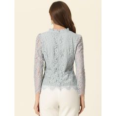 Add a bit of femininity to your look with the ruffle round-neck lace top. It features a long sleeve form, a ruffle neck, and lace fabric. It perfectly matches everyday jeans and skirts for a weekend casual look. A lace top puts a feminine spin on any day or night look with a charming feminine silhouette. Good options for parties, sweet dating, shopping, festivals, banquets, office outfits, casual wear, and daily outfits. Crew Neck Lace Blouse With Lace Trim, Party Blouse With Lace Top And Crew Neck, Crew Neck Lace Top With Lace Sleeves For Fall, Fall Crew Neck Lace Top With Lace Sleeves, Long Sleeve Scalloped Lace Top, Feminine Party Tops With Lace Cuffs, Elegant Crew Neck Lace Top For Fall, Long Sleeve Scalloped Lace Blouse For Spring, Elegant Ruffled Lace Top