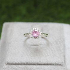 * Material: 925 Sterling Silver * DETAILS ✥ Handmade Ring ✥ - Center Stone: Lab Pink Sapphire  - Center Stone Size: 6 MM - Center Stone Shape: Round  - Side Stone: CZ diamond  ✥ O T H E R ∙ I N F O R M A T I ON ✥ ♦ Your item will be nicely packed to gift in elegant jewelry boxes. ♦ Custom Order We can make custom rings in almost any shape and style. If you want a specific model, please send us a clear picture and we will do our best. ♦ Delivery All Item will be Shipped within 3 to 5 Days after payment receive. The delivery time usually takes 11 to 23 days, depending which Country & location. ♦ Payment we accept payment through PayPal only, Payment should be made within 3 days of purchase. ♦ Ring Size Visit your local jeweller to be sized, (Most offer this service for free). I can make this Round Sapphire Ring, Pink Gemstone Ring, Pink Gemstones Ring, Round Sapphire, Pink Sapphire Ring, Pink Gemstones, Cz Diamond, Ring Engagement, Jewelry Boxes