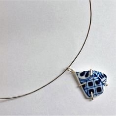 Sterling silver choker with a pendant of Delft ware porcelain, set in silver. The diameter of the necklace is 14 centimeters. Artistic Choker Jewelry Gift, Artistic Choker Jewelry As A Gift, Artistic Choker Jewelry For Gifts, Unique Pendant Choker As Gift, Artistic Choker Necklace For Gifts, White Pendant Choker As Gift, Handmade Sterling Silver Pendant Choker, Artistic Sterling Silver White Necklace, Handmade Round Pendant Choker Gift