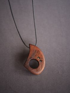 Hand made wooden necklace. The necklace is made of mulberry wood,the Latin name is Morus alba.More precisely, from a piece of trunk that is over a hundred years old. Dried mulberry wood hides this beautiful and warm structure whose beauty inspired me to make a necklace. Each of my necklaces is unique. Handmade Wooden Necklace Gift, Gift Wooden Bead Necklaces In Natural Wood, Natural Wood Necklaces With Wooden Beads For Gift, Unique Wooden Necklace For Gift, Wooden Pendant Necklace For Gift, Handmade Artisan Wood Necklaces, Handmade Mahogany Necklace For Gift, Brown Wooden Necklace Gift, Brown Wooden Necklace For Gifts