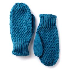 a pair of blue knitted mittens sitting on top of a white surface