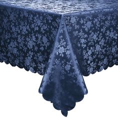 a blue table cloth with white flowers on it and a black lace border around the edge