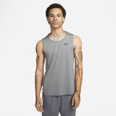 The sweat-wicking Ready Tank keeps you fresh for all your fitness activities. We gave it a relaxed fit with quick-drying, breathable fabric to help you stay cool when your workout heats up. Nike Tank Tops Men, Fitness Tank Top, Nike Swoosh Logo, Running Tanks, Fitness Activities, Running Tops, T-shirts & Tank Tops, Workout Tanks, Sports Top