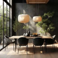 a dining room table and chairs with plants in the center, hanging lights above them