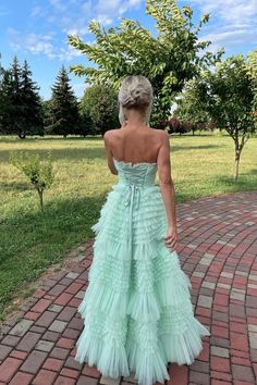 Expertly crafted from tulle material in a stunning mint green color, this gown features an A-line silhouette and a strapless neckline. With a high waist and full length tiered ruffle skirt, it also boasts a high-low hemline and a built-in bra for added support. SKU: 3446 Mint green color Tulle material A-line silhouette Strapless neck High waist Full length Tiered ruffle skirt High low Built-in bra Ship in 7-10 business days Size: US 2-16. We offer free returns in 7 days. Please refer to our return policy page for more details. If you have any questions, don't hesitate to contact us: at service@dressesforparty.com. Formal Prom Dresses Long, Ruffle Gown, Tulle Material, Tulle Sleeves, Floor Length Prom Dresses, Tiered Ruffle Skirt, Cute Prom Dresses, Strapless Maxi, Long Prom Dress