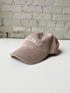 This Holland "Dad Hat" is a classic. The neutral tones are sure to match every outfit all year round. Embroidered locally in Grand Rapids. Regular fit 100% Cotton Hand wash Casual Beige Cotton Hat, Beige Cotton Hat With Curved Brim, Trendy Khaki Cotton Hat, Casual Cream Cotton Hats, Khaki Cotton Baseball Cap With Short Brim, Spring Khaki Cotton Baseball Cap, Cotton Hat With Curved Brim For Fall, Curved Brim Cotton Hat For Fall, Fall Cotton Hat With Curved Brim