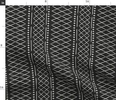 a black and white pattern on fabric with measurements for the width of each piece, including one