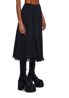 This midi skirt has a twill construction with sheer lace detailing, side pockets, an elastic waistband, picot trim, a ruffled lace hem, and front button closures. Spring Black Skirt With Lace Trim, Black Skirt With Lace Trim For Spring, Flared Skirt With Lace Trim, Gothic Skirt With Lace Trim, Black Lace Trim Skirt For Spring, Spring Lace Trim Midi Skirt, Black Knee-length Skirt With Ruffles, Black Ruffled Knee-length Skirt, Black Skirt With Lace Trim For Summer