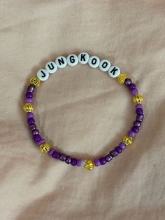 A hand-crafted glass bead friendship bracelet to celebrate Jungkook of BTS! A cute concert accessory or a cute way to show off your favorite bias!  This bracelet is made with Czech glass beads, plastic letter beads, plastic spacer beads, and is on an elastic thread measured at about 10 inches in length for a relaxed/loose fit. If you would like the bracelet you order to be smaller or larger, please leave the requested size in inches in the personalization box!  All bracelets are made to order and are typically shipped out within 1-3 business days unless otherwise stated. Adjustable Kpop Bracelets With Letter Beads, Adjustable Kpop Style Friendship Bracelets With Letter Beads, Adjustable Kpop Letter Beads Bracelets, Personalized Kpop Beaded Bracelets For Friendship, Adjustable Kpop Bracelet With Letter Beads, Adjustable Kpop Bracelets With Round Beads, Kpop Style Friendship Bracelets With Round Beads, Kpop Style Letter Beads Jewelry, Personalized Kpop Beaded Bracelets With Round Beads