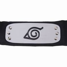 a black and white belt with an image of a spiral on the front, in metal studs