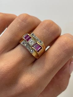 Vintage Ruby Tank Ring, 0.30CT Old Mine Diamond, 14k Yellow Gold Ring, Antique Jewelry, Gold Tank ring, ruby baguette ring, Estate Jewelry ~~ S e t t i n g ~~ Solid 14k Yellow Gold 8.00 grams Ring Size 7.5,7.25,7,7.75,8;7.5 US   ~~ Stones ~~ Main Stone: Old Mine Shape Natural Diamond In Weight Of 0.30 Ct (Approx.)  Clarity - Si2 Color  - F Side Stones: Baguette Shape Natural Ruby In Weight Of 1.20 Ct (Approx.) Color  - Pink So who is Nola? Nola is our creation and imagination. All the idea of No Red Ruby Ring With Baguette Diamonds, Ruby Jewelry With Baguette Diamonds For Anniversary, Anniversary Ruby Jewelry With Baguette Diamonds, Anniversary Yellow Gold Ruby Ring With Baguette Diamonds, Red Baguette Diamond Rings For Anniversaries, Anniversary Jewelry With Baguette Diamonds And Ruby, Red Baguette Diamond Rings For Anniversary, Vintage Diamond Ring With Baguette Cut, Baguette Cut Ruby Ring With Baguette Diamonds For Wedding