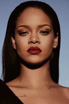 a close up of a person wearing red lipstick