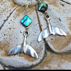 Abalone shell silver whales tail Boho beach earrings.These hand cast whales tail earrings have lots of detail and richness. They are Sterling silver over pewter hand cast with abalone shell beads. They look fabulous on everyone!Very light weight! Ear wires are sterling silver.These earrings are 2 inches long and 1 inch wide across the tail.All my jewelry comes gift boxed with a custom Shelly Mariposa Design butterfly card ready for gift giving, whether it is a gift for you or someone special.You Silver Ocean-inspired Earrings For Gifts, Silver Ocean-inspired Earrings, Ocean-inspired Sterling Silver Mermaid Jewelry, Ocean-inspired Mermaid Shape Sterling Silver Jewelry, Ocean-inspired Mermaid Sterling Silver Jewelry, Nickel Free Sterling Silver Jewelry For Beach, Nickel-free Sterling Silver Jewelry For The Beach, Shell-shaped Sterling Silver Jewelry For Beach, Adjustable Silver Shell-shaped Earrings