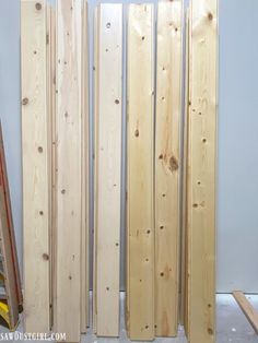 several pieces of wood sitting next to each other in a room that is being built