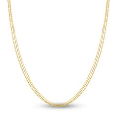 Dazzling bead, box and figaro chains stack and drape elegantly to accentuate any style in this contemporary women's triple layer chain necklace. Fashioned in 14K yellow gold, the 18-inch chain secures in place with a lobster clasp. The bead chain width measures at approximately 1mm, the box chain at 0.66mm and the figaro at 1.3mm. Elegant Multi-strand Figaro Chain Jewelry, Multi-strand Figaro Chain Jewelry Gift, Dainty Multi-strand Layered Necklace With Figaro Chain, Yellow Gold Multi-strand Figaro Chain Jewelry, Yellow Gold Box Chain Jewelry For Layering, Elegant Multi-strand Satellite Chain Jewelry, Elegant Multi-strand Satellite Chain Layered Necklace, Elegant Multi-strand Layered Necklace With Satellite Chain, Dainty Multi-strand Figaro Chain Necklace