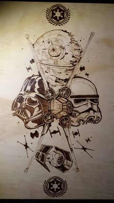 a drawing of star wars characters on a piece of wood with other items around them