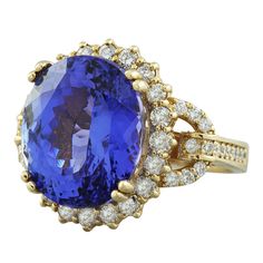 Stamped: 14K Total Ring Weight: 9.8 Grams Tanzanite Weight: 18.80 Carat (14.80x12.60 Millimeters) Diamond Weight: 1.35 Carat (F-G Color, VS2-SI1 Clarity )Face Measures: 18.90x16.50 Millimeter SKU: [600164] Oval Yellow Gold Halo Ring Gia Certified, Yellow Gold Tanzanite Diamond Ring With Halo Setting, Formal Yellow Gold Tanzanite Rings, Formal Yellow Gold Halo Ring With Center Stone, Gia Certified Gold Sapphire Ring For Formal Occasions, Gold Tanzanite Rings For Formal Occasions, Formal Gold Sapphire Ring Gia Certified, Yellow Gold Formal Cluster Ring With Halo, Formal Yellow Gold Cluster Ring With Halo