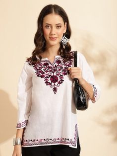 Elevate your wardrobe with this stunning handmade White Straight Kurti, featuring exquisite floral embroidery. Designed with a round neck and three-quarter regular sleeves, this kurti showcases intricate Aari work detail, adding a touch of traditional elegance. Crafted from machine-woven pure cotton, it promises both comfort and durability. Size & Fit: - The model (height 5'8") is wearing a size S. Material & Care: - Pure Cotton - Easy care and maintenance.  Perfect for both casual outings and s Festive Embroidered Kurta With 3/4 Sleeves, Festive 3/4 Sleeve Embroidered Kurta, Eid Kurta With Floral Embroidery And 3/4 Sleeve, Spring Embroidered Kurta With 3/4 Sleeves, Spring Kurta With Floral Embroidery And 3/4 Sleeves, Traditional Floral Embroidered Kurta With 3/4 Sleeves, Traditional Kurta With 3/4 Sleeves And Floral Embroidery, Traditional Kurta With Floral Embroidery And 3/4 Sleeves, Festive Traditional Kurta With Embroidered Hem