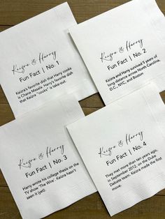 four white napkins with black writing on them