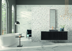 an elegant bathroom with marble walls and flooring