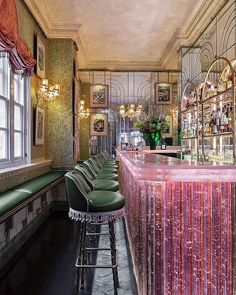 the bar is decorated in green and pink