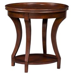 a round wooden table with a shelf underneath it