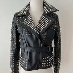 One Teaspoon Nwt Size Small Black Leather Jacket With Gold/Brass And Silver Studs. It Is New With Tags, But Missing 1 Brass Stud On The Arm (Underneath). Retails At $649 Studded Winter Outerwear For Party, Studded Winter Party Outerwear, Trendy Studded Outerwear For Winter, Trendy Black Studded Outerwear, Studded Black Outerwear For Fall, Black Studded Outerwear For Fall, Silver Biker Jacket For Fall, Silver Long Sleeve Biker Jacket For Fall, Silver Leather Long Sleeve Jacket For Fall