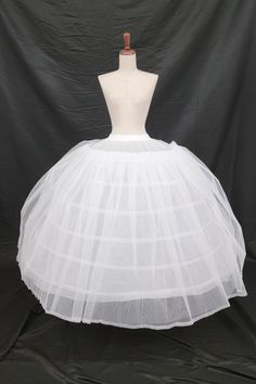 Petticoat with 6 hoops and two mesh outer layers. Features elastic lace up waistband and hook and eye closure. I also have a version of this style without elastic in my store. One size fits all. Pictured with one of our quinceanera dresses: style CHF3066. Tulle Ball Gown With Attached Cancan For Debutante Ball, Fitted Quinceanera Dress With Tulle Skirt, Fitted White Quinceanera Dress, Fitted Ball Gown With Attached Cancan For Quinceanera, White Fitted Tulle Quinceanera Dress, Stretch White Tulle Petticoat, White Crinoline Petticoat With Gathered Skirt, Lace Petticoat With Attached Cancan, Tiered Skirt, White Tiered Gathered Petticoat