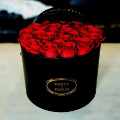 a black box with red roses in it