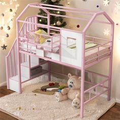 a teddy bear sitting in front of a pink bunk bed with a desk underneath it