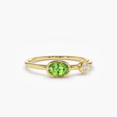 This exquisite 14k Gold Oval Peridot an Diamond Ring is a stunning piece of jewellery that exudes elegance and sophistication. Crafted from the finest materials, this ring features a sparkling oval-shaped peridot stone that is beautifully complemented by a halo of dazzling diamonds. The band is crafted from high-quality 14k gold, ensuring that it is both durable and luxurious. Whether worn as a statement piece or as part of a collection, this ring is sure to turn heads and make a lasting impression. Perfect for any occasion, this ring is a must-have for any jewellery lover.DetailsMade to Order.Gold Kt: 14k Solid GoldCustom Gold Color: Rose Gold, Yellow Gold, White RhodiumDiamond Cut: RoundNumber o Diamond and Size:  Diamonds 2.50MMGemstone and Cut: Oval Shape PeridotPeridot Size: 6x4 MMTot Layering Diamond Necklaces, Diamond Silver Ring, Silver Diamond Ring, Peridot Ring, Peridot Gemstone, Diamond Color, Silver Diamonds, Diamond Gemstone, 925 Sterling Silver Jewelry