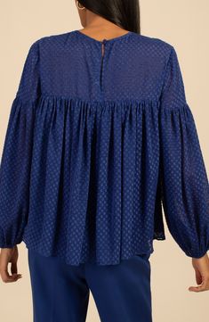 Airy georgette fabric defines this blousy-sleeve top covered in a clip-dot texture. Back keyhole with button-and-loop closure Jewel neck Long sleeves with elastic cuffs
 100% polyester Dry clean Imported Blue Blouse With Balloon Sleeves For Work, Textured Long Sleeve Blouse For Fall, Chic Blue Lantern Sleeve Blouse, Textured Long Sleeve Fall Blouse, Fall Textured Long Sleeve Blouse, Blue Bishop Sleeve Blouse, Blue Blouse With Bishop Blouson Sleeves, Chic Textured Long Sleeve Blouse, Chic Long Sleeve Textured Blouse