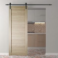 an open sliding door in a kitchen with white walls and floor tiles on the floor