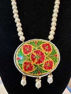 Ready to ship necklace with earrings Made using shell pearls , kundan and meenakari work Length of necklace with string is 12 inches Pendant measurement Width 3 inch Length is 2.5 inch Earrings length is 1inch 1.5 inch with pearls Delivered in 3-5 days within USA Meenakari Pendant Jewelry For Puja, Handmade Kundan Pearl Necklace Gift, Handmade Pearl Necklace For Diwali Celebration, Kundan Pearl Pendant Necklace As A Gift, Temple Jewelry With Meenakari Round Pendant, Meenakari Round Pendant Temple Jewelry, Meenakari Temple Jewelry Round Pendant, Pearl Pendant Necklace As Diwali Gift, Pearl Pendant Necklace For Diwali Gift