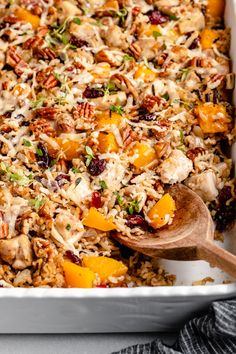 a casserole dish filled with rice and vegetables