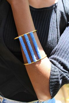 Handcrafted in Nairobi, Kenya. A beautiful, unique beaded brass cuff that is a must have for all! Simple but elegant! Perfect gift for a loved one. Width- 6.3cm Adjustable wrist width. SHIPPING Express shipping (via DHL) takes 2-4 WORKING DAYS to be delivered to you. Beaded Braclets, Brass Cuff, Beaded Cuff Bracelet, Brass Bracelet, Nairobi, Gold Cuffs, Beaded Cuff, African Jewelry, Earring Tutorial