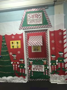 the door to santa's workshop is decorated with christmas decorations