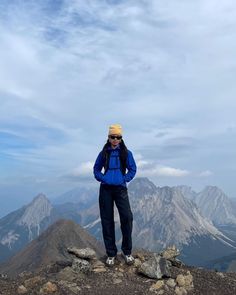 a person standing on top of a mountain