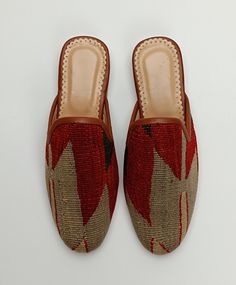 Welcome to AliDesignStore This Kilim Mules one -of-A-kind! Upper Made of a Hand-Selected Vintage Turkish Kilim Rug .  Kilims Rugs Are Hand Crafted From Vegetable Yarn. Have Stronger weave. - Handcrafted - Materials : Handwoven Kilim Rug                       Leather Sole                        Leather Trimmed                       Leather Lining                       Stacked Leather Sole                       Rubber Under The Stacked Heel  Care:   Soft Clothing Brush İs Recommended To Clean The Slipper. İf Something Spill on it.You Can Clean İt a Cloth With shampoo. - Ships from a small business in Turkey Traditional Slip-on Clogs With Rubber Sole, Handmade Bohemian Closed Toe Moccasins, Bohemian Handmade Slip-on Slippers, Bohemian Handmade Slip-on Mules, Handmade Bohemian Closed Toe Slippers, Handmade Bohemian Closed Toe Mules, Handmade Bohemian Slip-on Mules, Traditional Summer Loafers With Round Toe, Traditional Leather Sole Slip-on Loafers