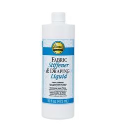 a bottle of liquid that is on a white background with the words, fabric buffer and drapering liquid