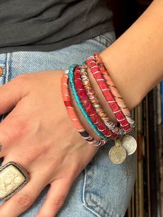 Stack up on these colorful & bold boho bangles!  I wrap each bracelet by hand with unique upcycled sari silk and finish with a wire wrap to secure.  Add vintage kuchi coin charms to a few or all to complete the look, These bracelets are a super simple and lightweight for easy, comfortable wear. Select one or mix and match to create your own personalized set! ★ Handmade ★ Upcycled Sari Silk ★ Non-Tarnish Wire ★ Vintage Kuchi Coin Charm ★ 65mm inner diameter ✉ Message for Custom Requests ✈ Free Shipping  ♥ Handmade  💌 Gift Wrapped Handmade Bohemian Bangle As Gift, Bohemian Stackable Jewelry For Festivals, Handmade Wrap Bracelet Bangle For Friendship, Multicolor Hand Wrapped Wrap Bracelet For Festival, Adjustable Pink Bohemian Cuff Bracelet, Bohemian Adjustable Pink Cuff Bracelet, Bohemian Stackable Bangle Cuff Bracelet, Hand Wrapped Wrap Bracelet Bangle For Friendship, Bohemian Pink Cuff Bracelet As Gift