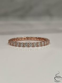 New In from our 2022 collection!  The Scarlett (2mm) in Rose Gold  Gorgeous Rose Gold Vermeil 2mm Full Eternity Band with Simulated  Diamonds all around. Hand crafted in fine Sterling Silver and  plated with  Rose Gold it is guaranteed not to rust or turn your finger green. We picked the best 5A CZ diamonds available on the market to make this ring shine like real Diamonds!  *Please note: We strongly recommend to avoid body lotion, harsh chemicals and water to make sure gold stays long.   ⭐️If y Vs Clarity Rose Gold Eternity Band For Promise, Vs Clarity Rose Gold Eternity Band As Promise Ring, Rose Gold Cubic Zirconia Eternity Band, Rose Gold Round Cut Eternity Band With Halo, Rose Gold Halo Round Cut Eternity Band, Rose Gold Stackable Rings With Halo, Rose Gold Halo Stackable Rings, Rose Gold Stackable Eternity Band, Rose Gold Halo Eternity Band