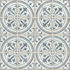 a blue and white tile pattern with an ornate design in the center, on top of a