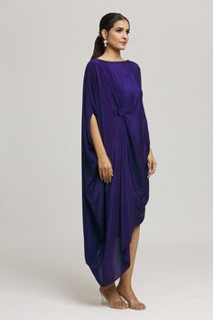 Blue dress in a draped style and a solid flowy silhouette. - Aza Fashions Draped Purple Evening Dresses, Purple Draped Evening Dress, Purple Draped Silk Dress, Pre-draped Dresses With Folds, Flowy Draped Evening Dress, Cocktail Asymmetrical Dress With Draped Sleeves, Asymmetrical Dress With Draped Sleeves, Blue Draped Dress With Folds, Flowy Draped Asymmetrical Dress