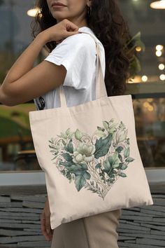 This 100% cotton bag comes in one size - 15" x 16"- perfect for everyday wear. While the canvas material will show off your designs in great colors, it's durable and will last for years. The bag features 20" handles (made from the same canvas), making it easy to carry even with a week's worth of shopping. .: 100% cotton canvas .: Heavy fabric (12 oz/yd² (406.9 g/m .: Sewn-in label .: Available in natural and black colors Botanical Cotton Canvas Bag For Everyday Use, Botanical Cotton Canvas Bag For Daily Use, Botanical Cotton Tote Bag, Everyday Cotton Canvas Bag With Floral Print, Botanical Style Cotton Tote Bag, Everyday Cotton Shoulder Bag With Floral Print, Everyday Floral Print Cotton Canvas Bag, Bohemian Cotton Canvas Bag For Daily Use, Floral Print Cotton Shoulder Bag