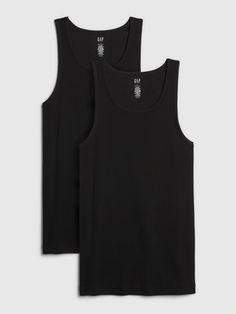 Soft rib-knit.  Sleeveless.  Round neckline. Casual Seamless Tank Vest, Casual Black Scoop Neck Vest, Casual Everyday Ribbed Vest, Casual Ribbed Sleeveless Vest, Casual Ribbed Scoop Neck Vest, Basic Black Sleeveless Tank Top, Casual Ribbed Vest For Everyday Wear, Casual Layering Vest With Tank Straps, Casual Ribbed Vest With Tank Straps